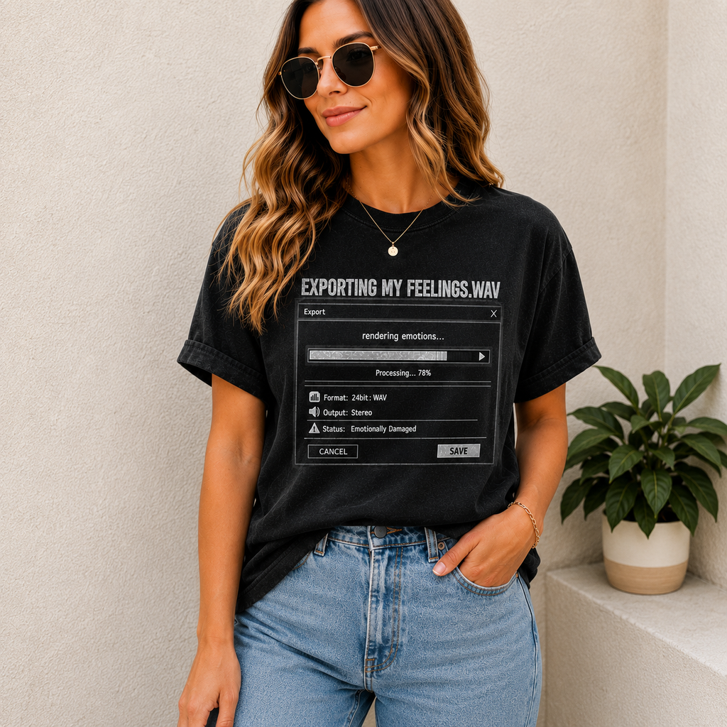 A woman wearing a black graphic t-shirt with a computer 'Exporting.