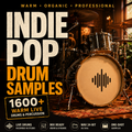 Promotional cover art for a music sample pack titled 'INDIE POP DRUM SAMPLES' with large textured text over a warm-toned photo of a drum kit in a live performance setting. The design includes badges reading '1600+ Warm Live Drums & Percussion' and feature icons for live drums, mix ready, WAV 24-bit, and one-shot samples.