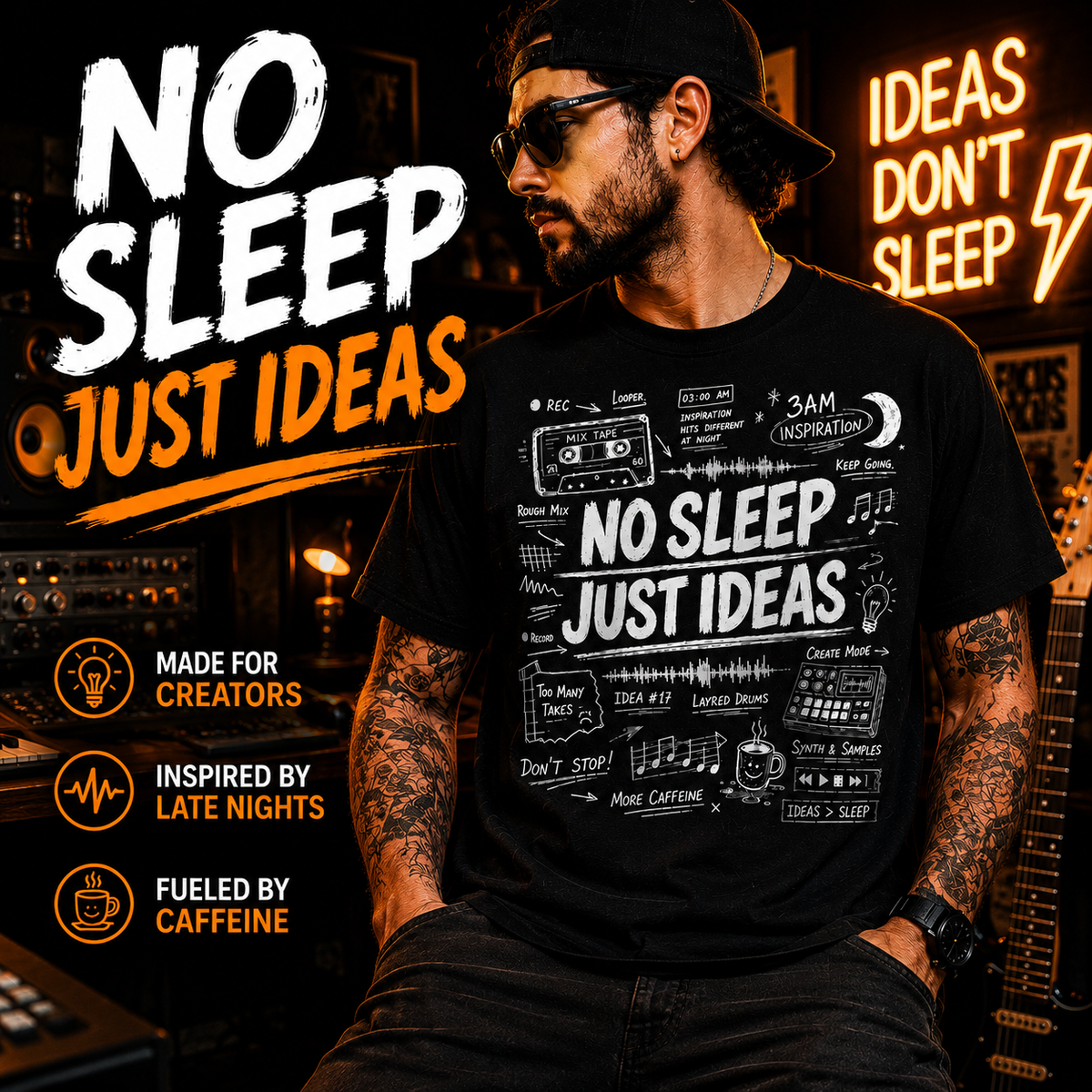 A man wearing a black graphic t-shirt with the text 'NO SLEEP JUST IDEAS' in white and orange, set against a dark studio background with neon signs and musical equipment.